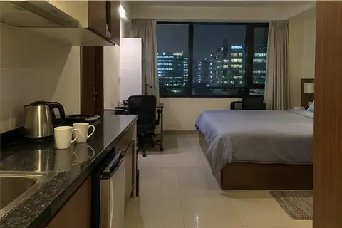 A service apartment in Hinjewadi at night