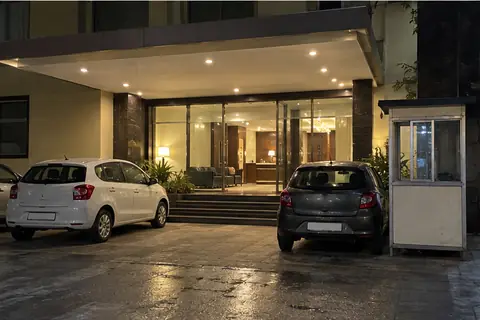 The front entrance of a business hotel in Pune at night